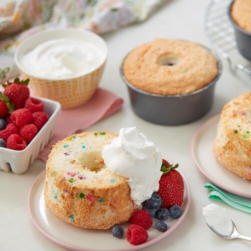 Mini-Angel-Food-Cakes Mini angel food cakes with whipped cream and berries