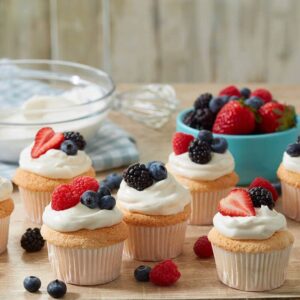Angel food cupcakes topped with mixture of berries