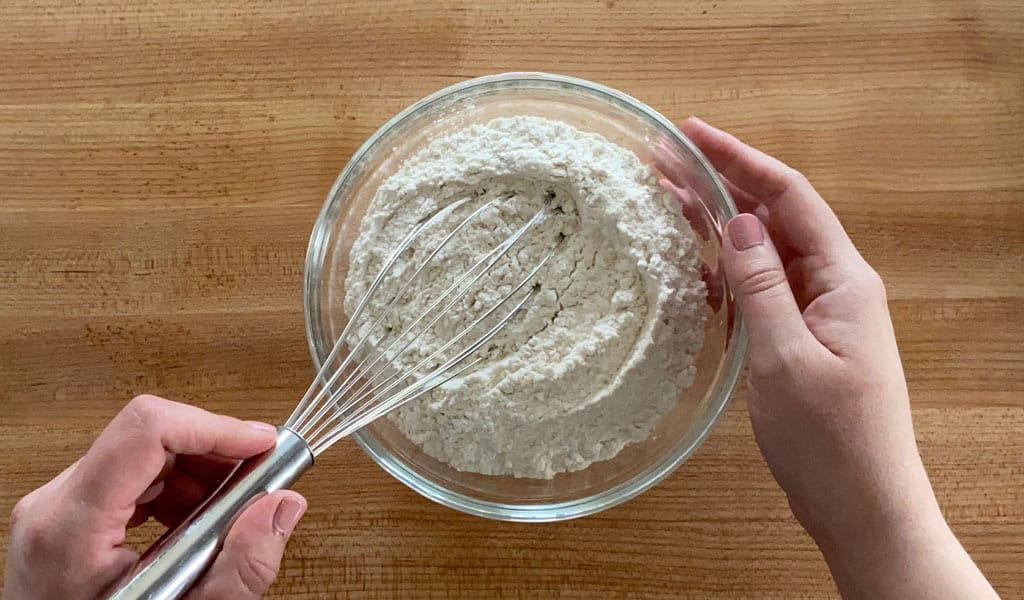 Lemon Cake Step 1- Mix dry ingredients mixing lemon cake dry ingredients