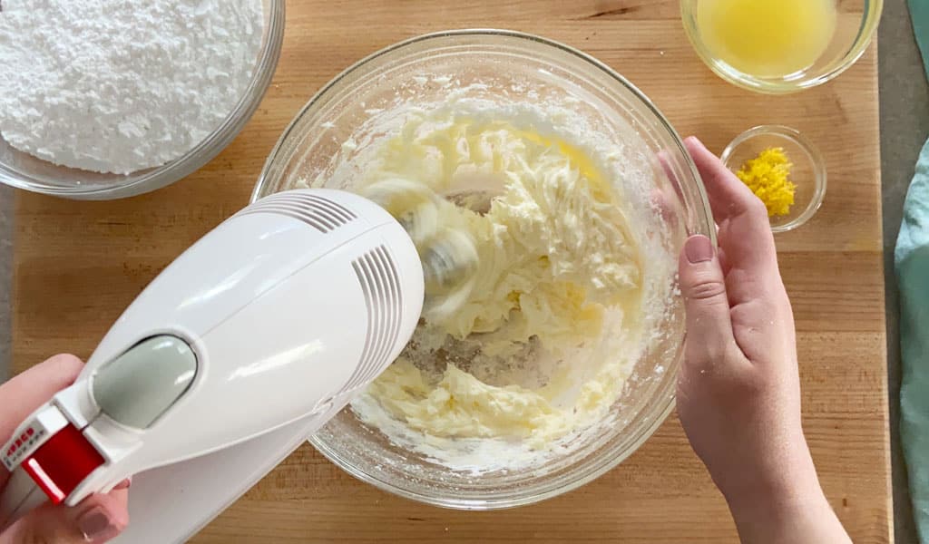 Lemon Cake Step 10- Icing beat butter beating icing