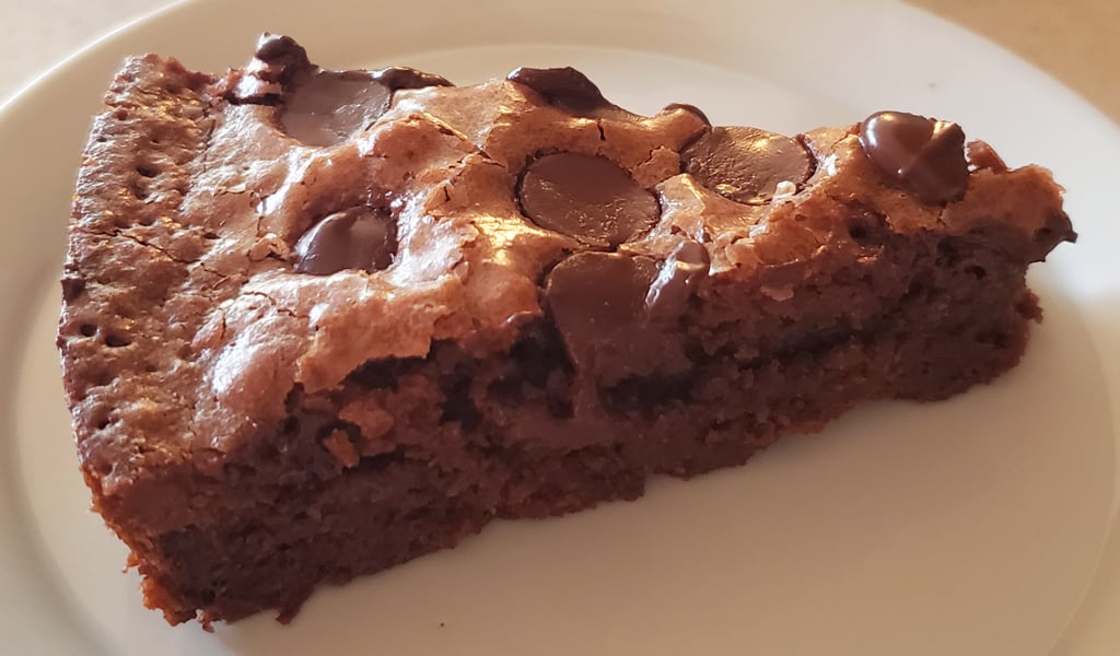 One-bowl brownie Step 9- Serve Brownies a slice of chocolate brownies with chocolate chips and walnuts