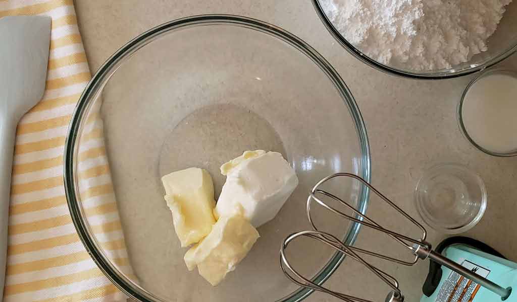 crusting-buttercream-frosting-step-1 butter inside of a mixing bowl