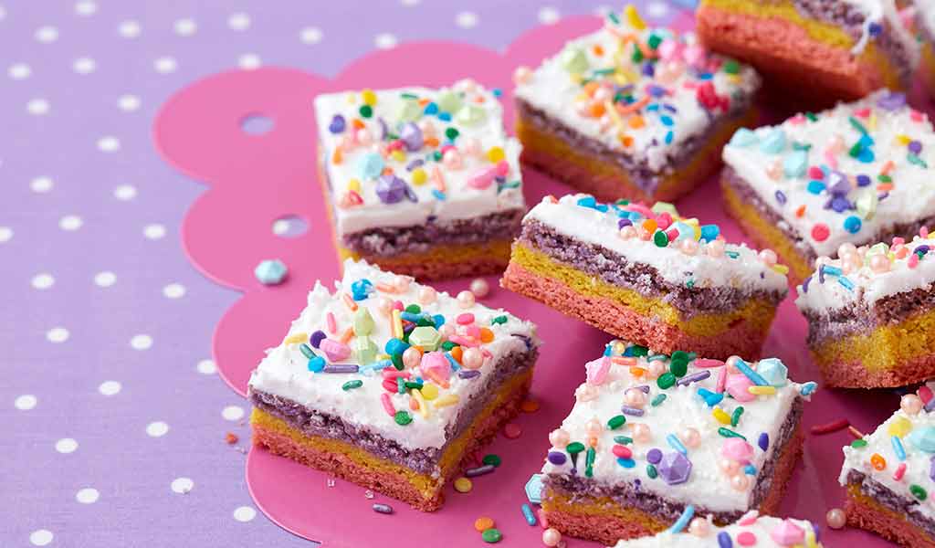 cookies bars decorated with white candy melts candy and multi color sprinkles 
