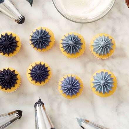 shades of black frosting on mini cupcakes