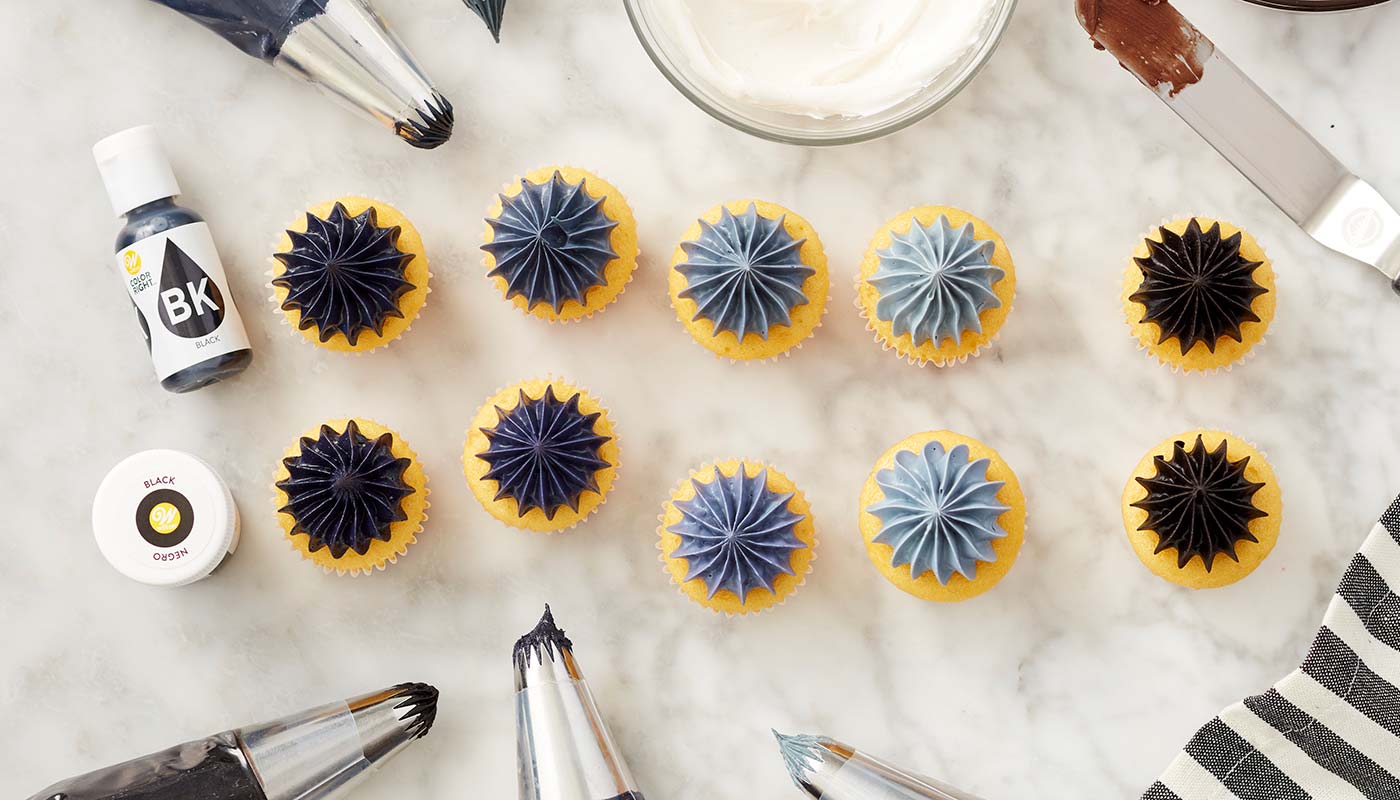 shades of black frosting on mini cupcakes