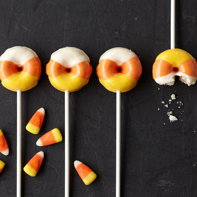 candy corn colored donuts on a stick