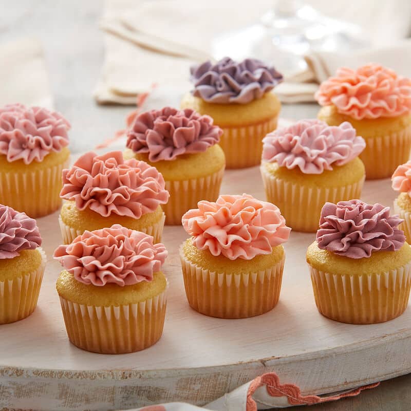 Carnation-mini-cupcakes mini coral frosted cupcakes