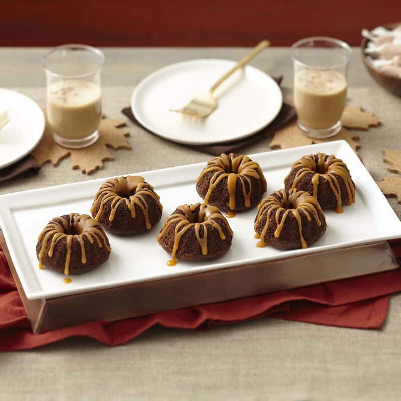 mini-chocolate-fluted-tube-cakes-with-salted-caramel-glaze-recipe_1 mini chocolate cakes topped with salted caramel glaze